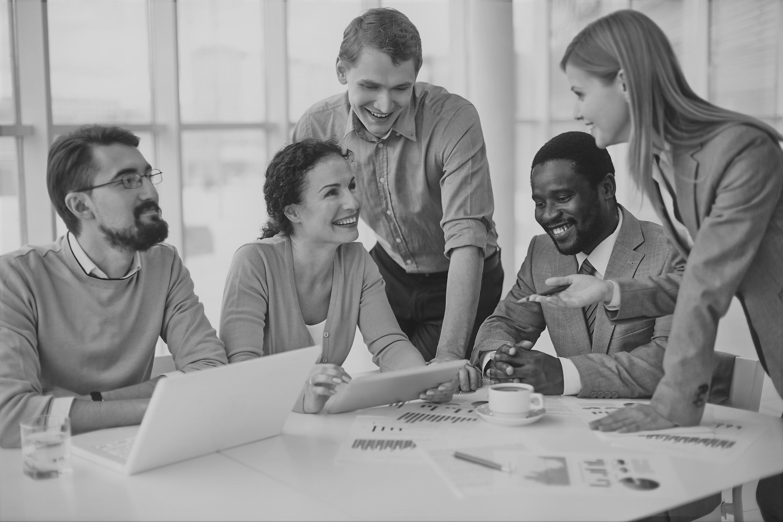 Group of business partners discussing strategies at meeting in office